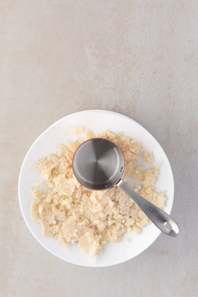 Mashed white beans on a plate.