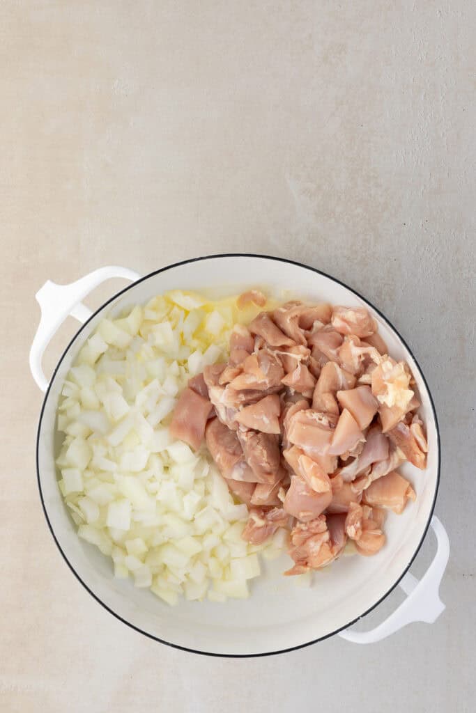 Butter, onions and chicken in a large pot.